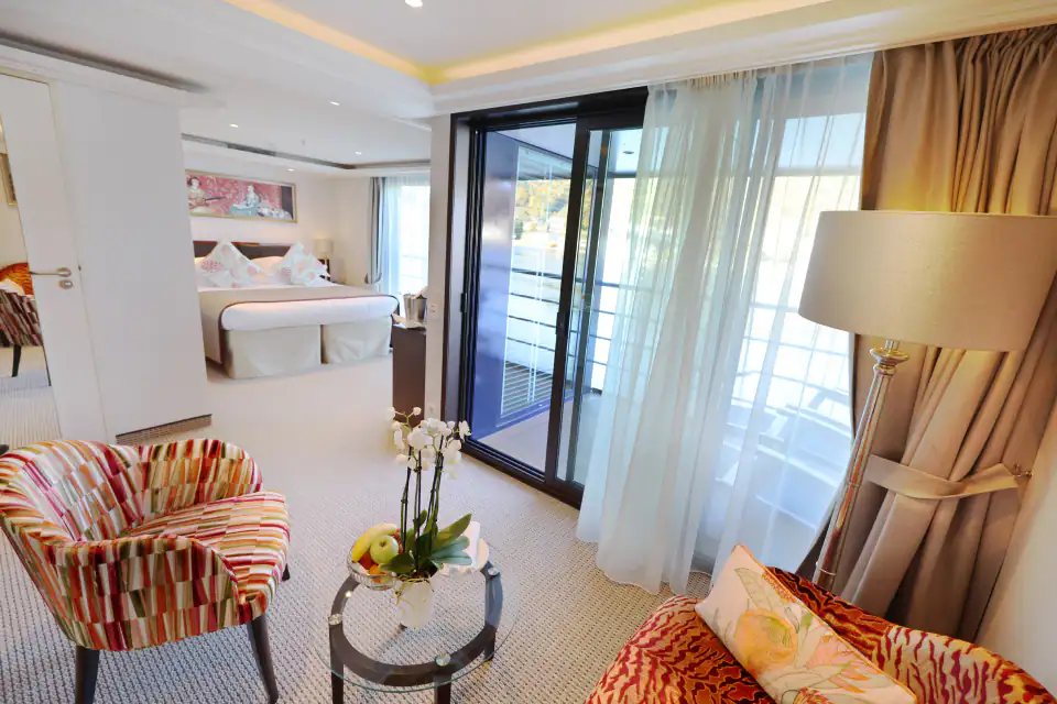 Outside balcony, french balcony, separate seating area and bed with large window