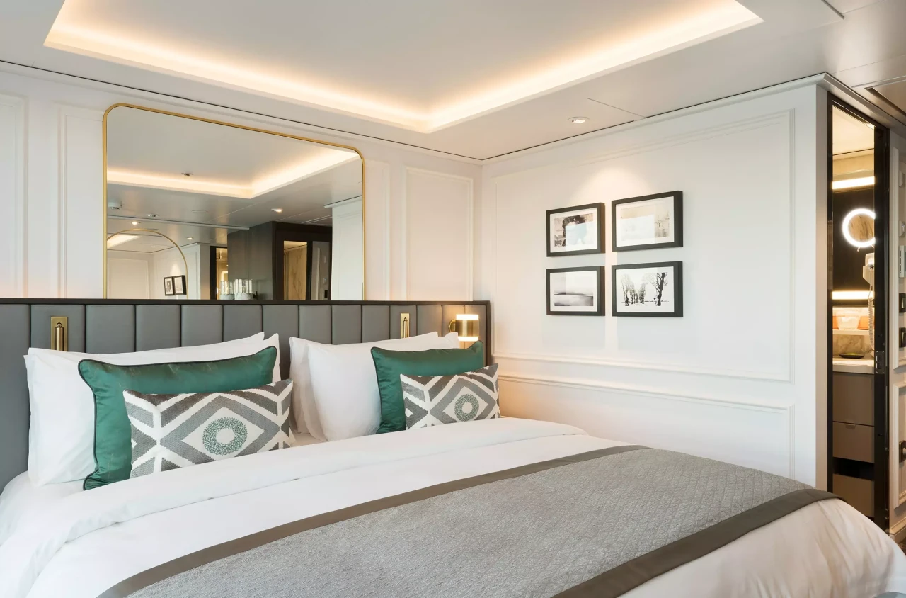 Bedroom with peek into bathroom