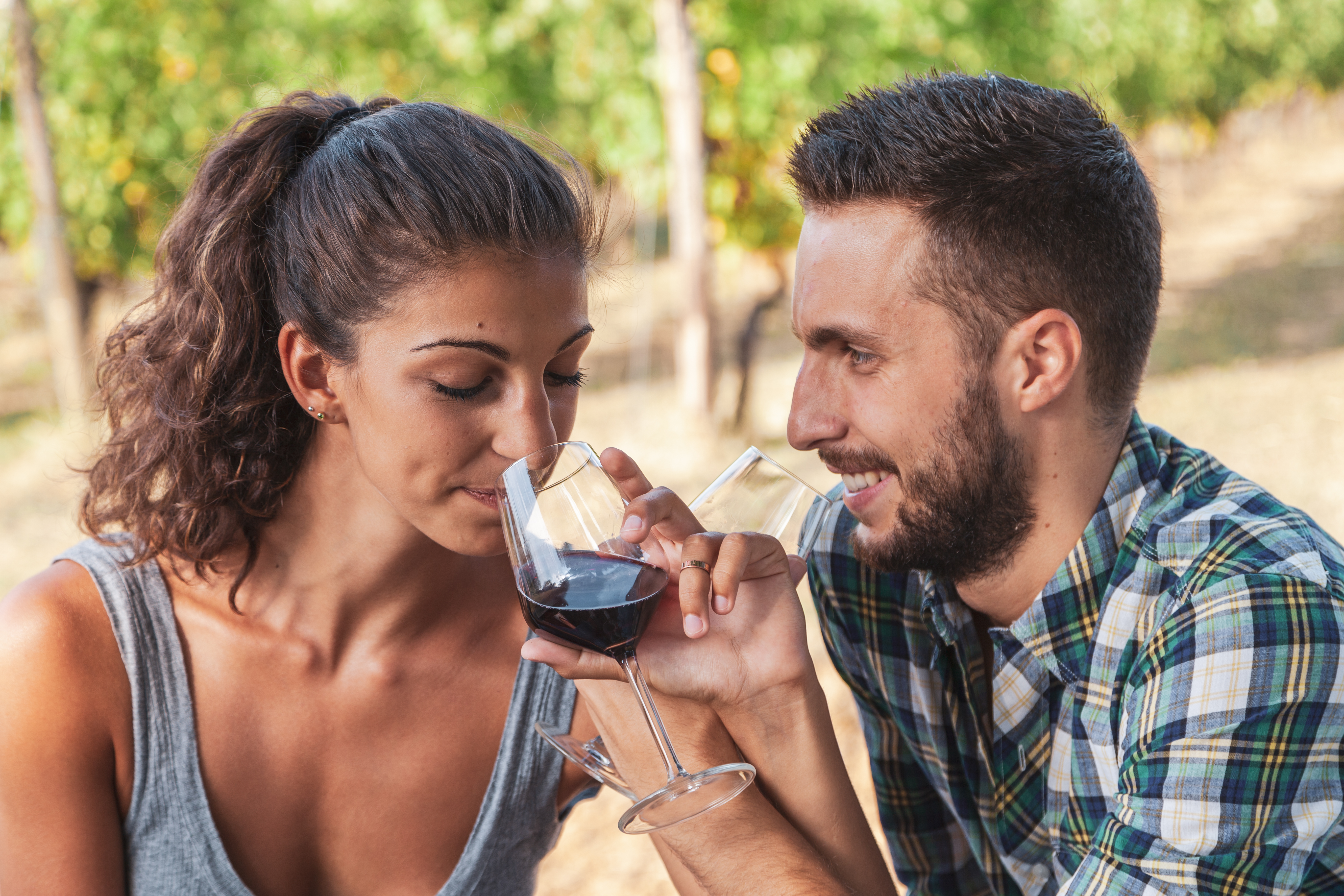 vecteezy_young-couple-of-winemakers-tasting-red-wine-from-a-glass_53607270.jpg